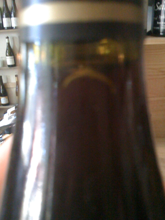 fingernail in a wine bottle